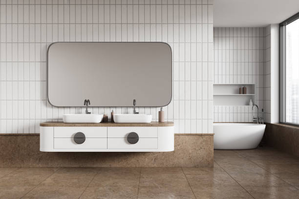 istock White tile bathroom interior with tub and double sink 1531071866
