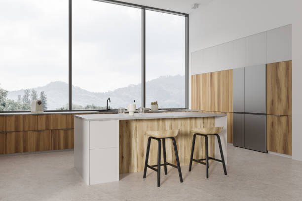 istock White kitchen interior with bar countertop and cooking corner, panoramic window 1531089137