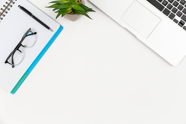 istock Notebook, glasses, pen and laptop on a white background isolated. 1531103020