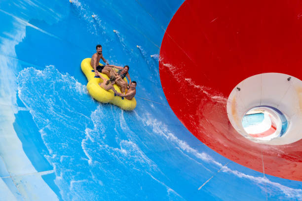 istock Friends having fun sliding in a big water slide 1531125282