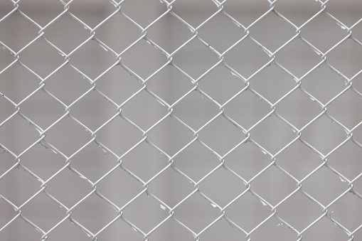 wire fence on the white wall background.