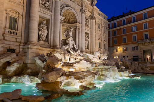 The Trevi Fountain (Fontana di Trevi) at night in city of Rome, Italy, world famous Baroque style city landmark from 1762.