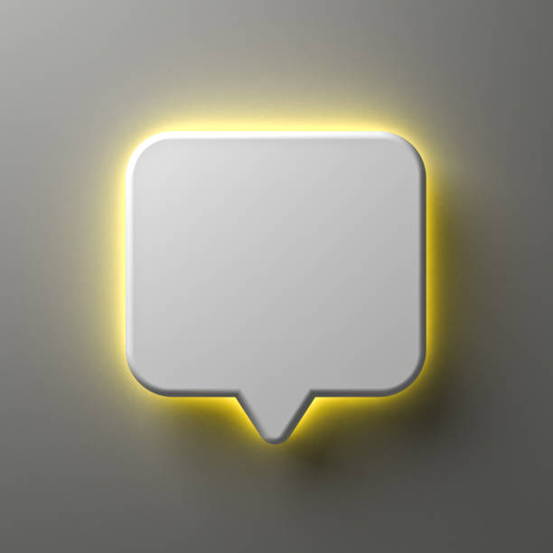 istock Blank white notification speech bubble sign pin or chat bubble with yellow neon back light isolated on dark white wall background with shadow minimal conceptual 3D rendering 1531168455