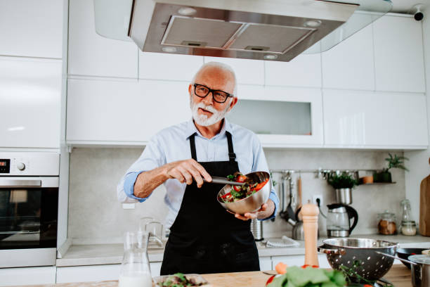 istock Handsome senior chef working as food vlogger 1531173938
