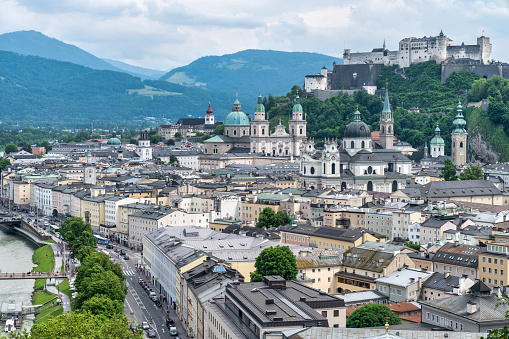 Beautiful view of famous Mirabell Gardens with the old historic Fortress Hohensalzburg in the background in Salzburg, Austria