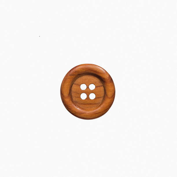 istock Retro brown wooden button isolated on white. Top view. 1531209780