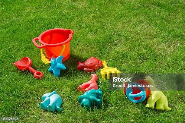 Garden Playtime Fun Stock Photo - Download Image Now - Dinosaur, Grass, Toy