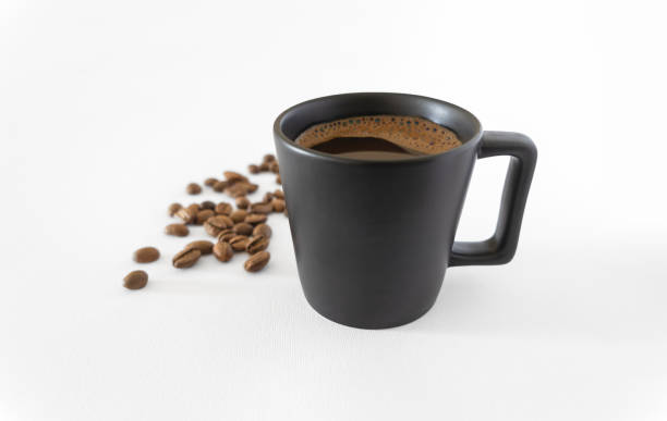 istock Coffee cup and coffee beans isolated on white background 1531266414
