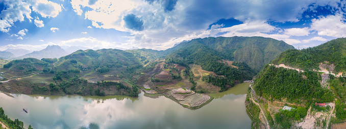 Aerial view of the pouring water season makes the terraced fields of Y Ty commune, Lao Cai province appear with the beautiful sky. Travel and landscape concept in North West Vietnam