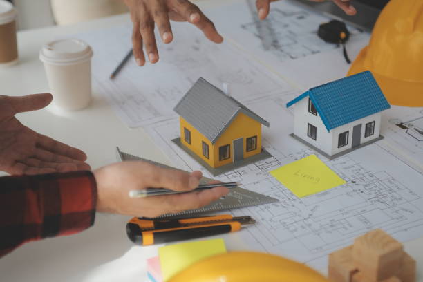 istock Engineer Teamwork Meeting, Drawing working on blueprint meeting for project working with partner on model building and engineering tools in working site, Construction and structure concept. 1531307507