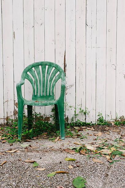 istock Green Chair Against White Fence 153131229