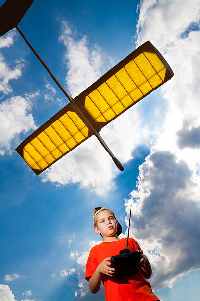 istock Little boy playing with airplane 153131953