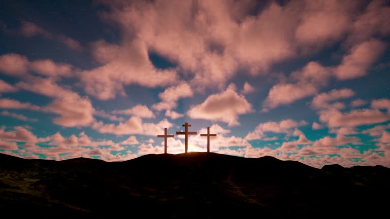 Three crosses on the hill with clouds moving on blue starry sky