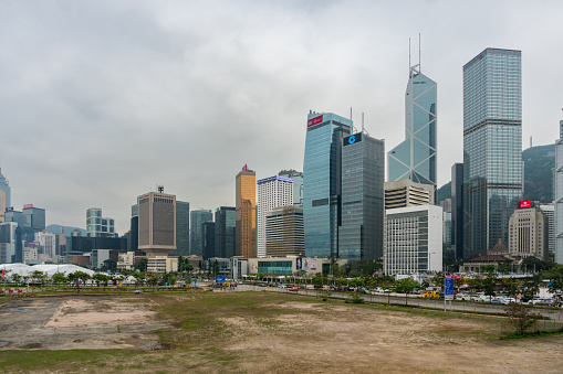 Hong Kong,March 25,2019:View of the Hong Kong skyscrapers near the ferris wheel on a cloudy day