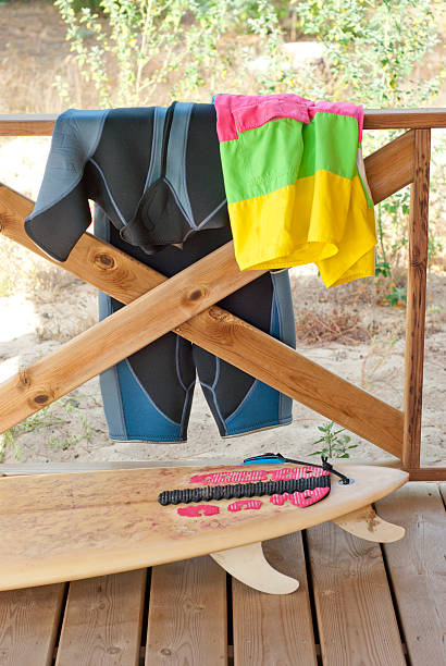 Surfboard and equipment on balcony of house stock photo