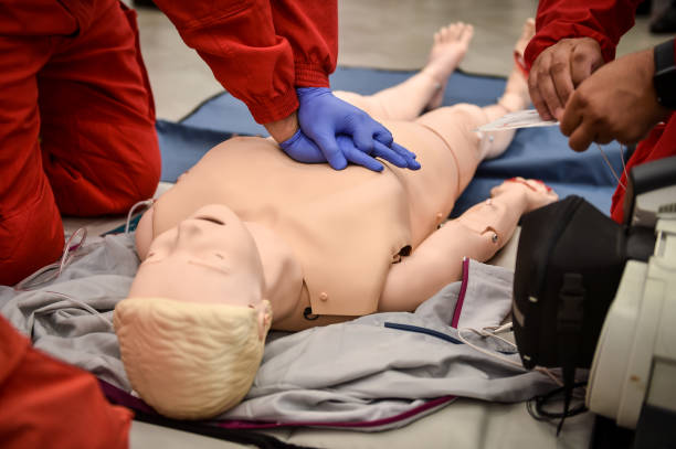 istock Paramedics simulate emergency intervention on medical training manikin 1531420595