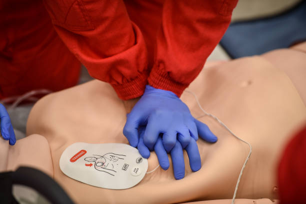 istock Paramedics simulate emergency intervention on medical training manikin 1531420598
