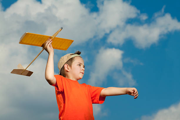 istock Little boy playing with airplane 153143008