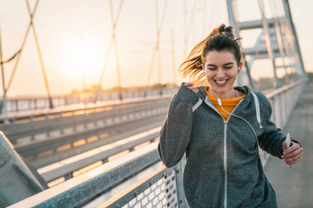 istock Sportswoman jogging at sunrise 1531439494