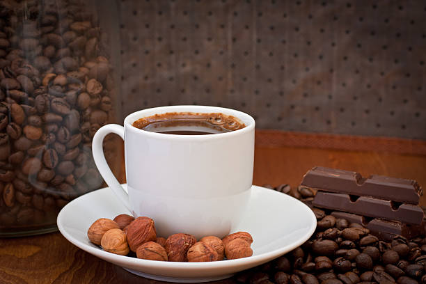 cup of coffee, hazelnut and chocolate stock photo