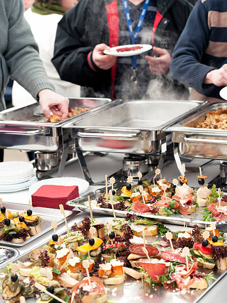 istock People choosing food from buffet 153146782