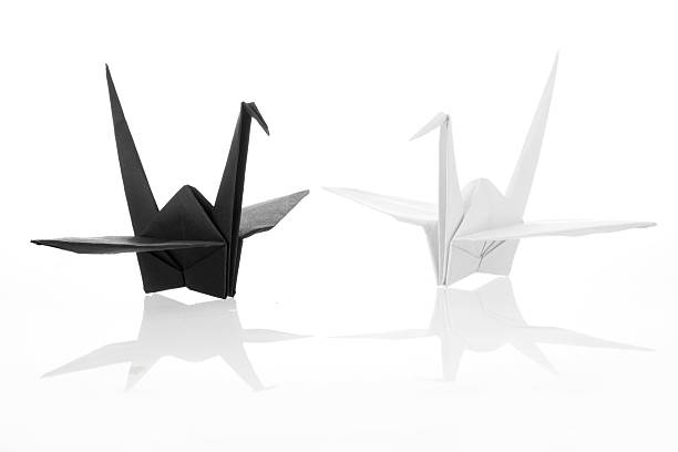 Black and white traditional Japanese origami crane bird isolated stock photo