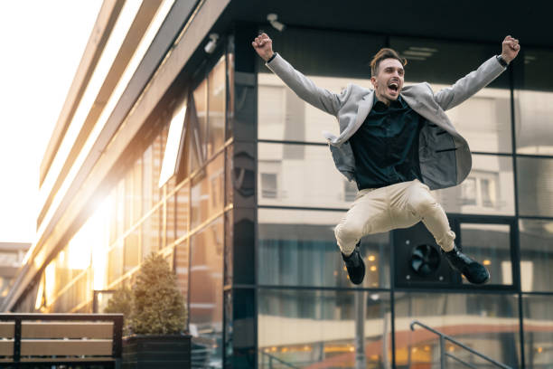 istock Success, it is my day! Cheerful businessman jumping 1531487010