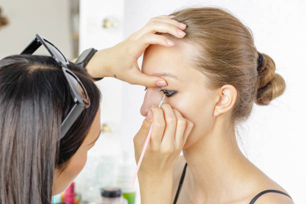 istock Young aspiring make-up artist applying make-up to a model 1531489551