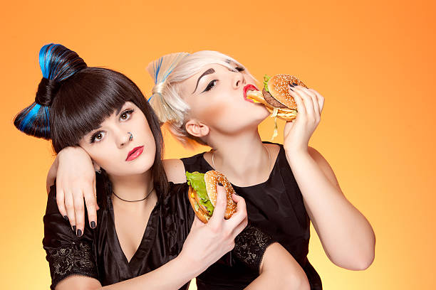 istock two girls with burgers 153149193