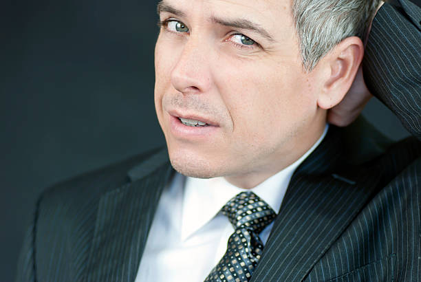 istock Stressed Businessman Looks To Camera 153149365