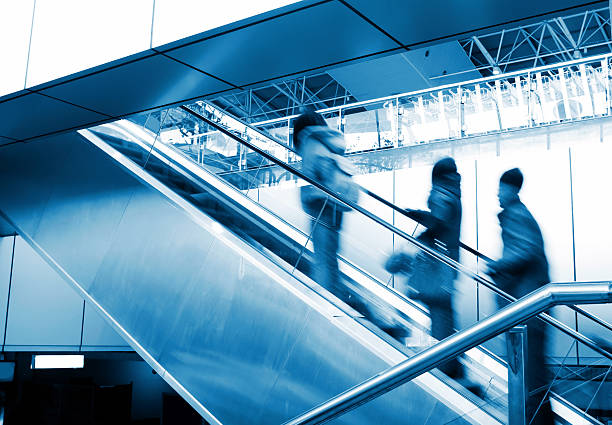 istock People at the airport escalator 153149620