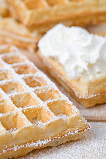 istock Sinfully delicious fresh waffles with icing & whipped cream 153150444