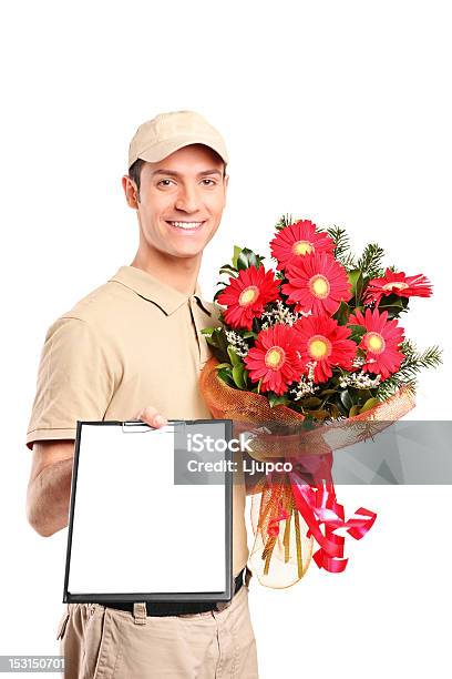 Delivery Boy Delivering Bouquet Of Flowers Stock Photo - Download Image Now - Adult, Adults Only, Beautiful People