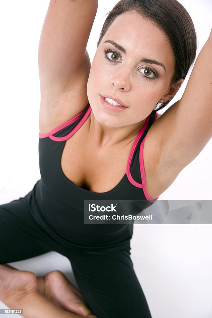 Beautiful Female Wearing Black Tights Stretches at the Gym Woman doing Yoga exercises Adult Stock Photo