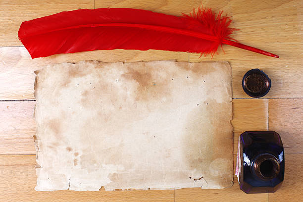 istock vintage paper with red feather pen, inkwell 153151498