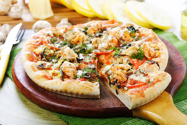 istock pizza with the cut of slice 153152048