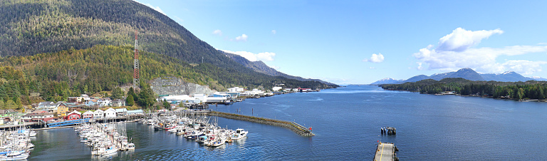 The water is turquoise blue in the port of Seward Alaska