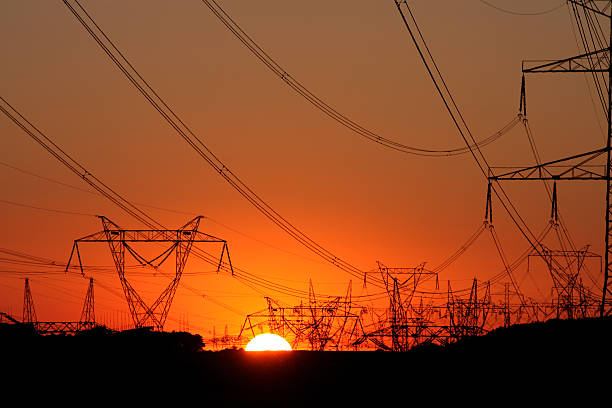 istock high voltage steel transmission tower during sunset 153153799