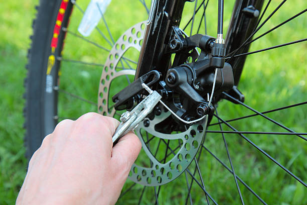 istock Adjusting Bicycle Gears with Pliers and Key 153153876