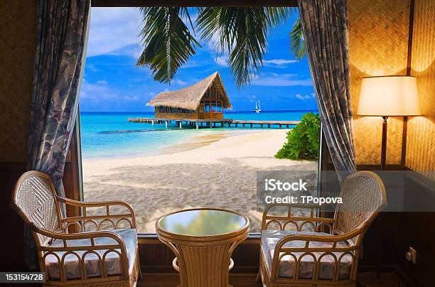 A Wicker Style Hotel Room On A Beautiful Landscape Stock Photo - Download Image Now - Beach, Looking Through Window, Looking At View