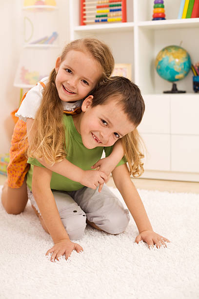 istock Kids wrestling and having fun 153156485