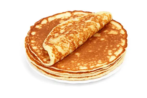 Pile of magnificent barmy pancakes on a white background