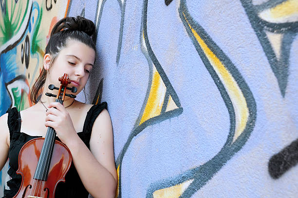 Portrait of a young woman holding violin