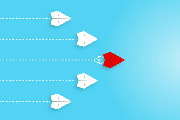 istock Leadership concepts with red paper airplane leading among white 1531581339