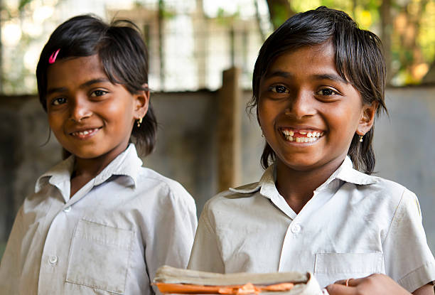 A beautiful girl reading in a school classroom