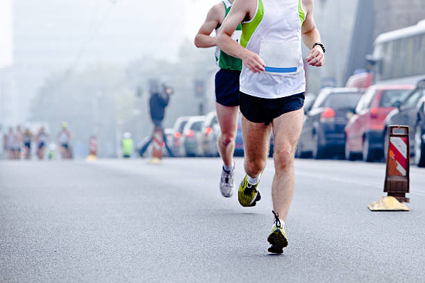 istock People running in city marathon 153158292