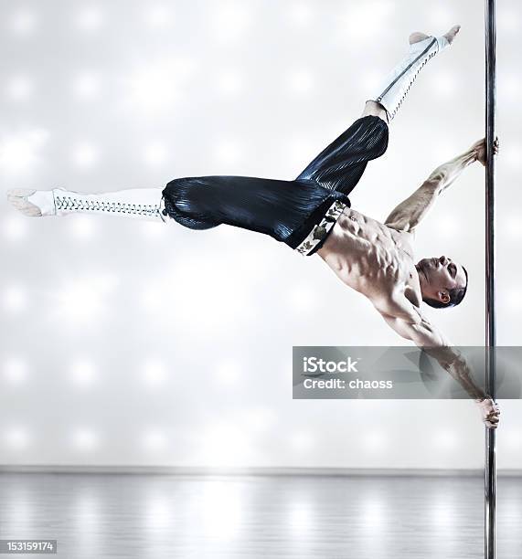 Strong Young Adult Man Does Flag On Pole Stock Photo - Download Image Now - 20-29 Years, Acrobat, Active Lifestyle