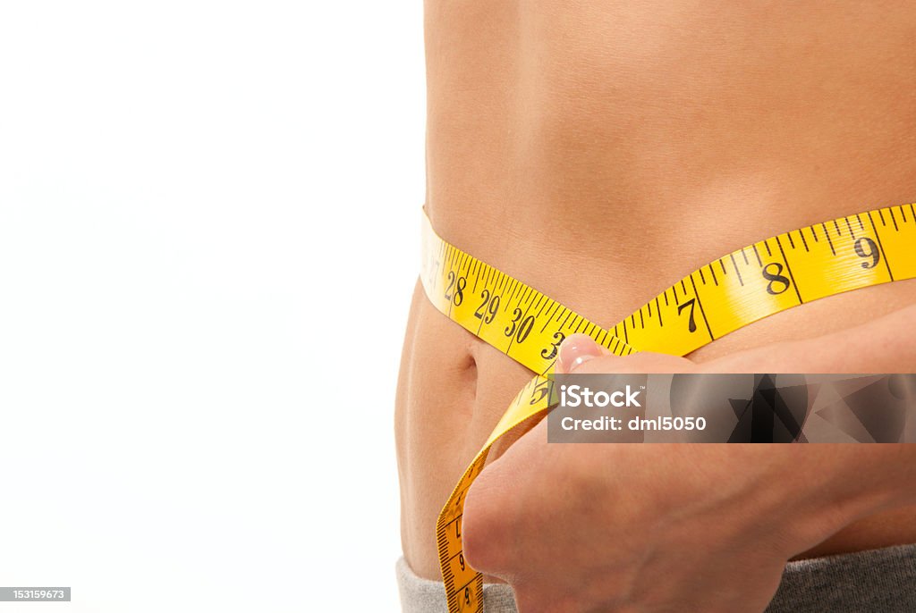 Mujer medir su cintura con la cinta métrica - Foto de stock de Abdomen libre de derechos