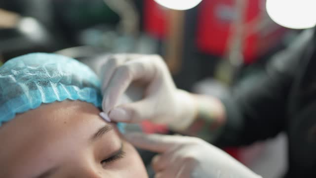 Cleaning face and disinfection to piercing at tattoo studio