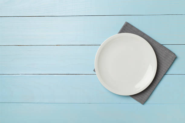 istock Empty round plate on wooden background, top view 1531616726